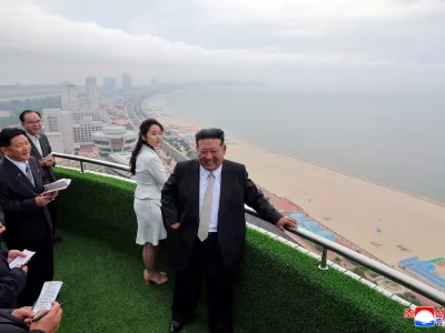 North Korean leader Kim Jong Un and his daughter Kim Ju Ae stand on a balcony facing the beach during a ceremony to celebrate the completion of the Wonsan Kalma Coastal Tourist Zone, in Wonsan, in North Korea, June 24, 2025. KCNA via REUTERS  ATTENTION EDITORS - THIS IMAGE WAS PROVIDED BY A THIRD PARTY. REUTERS IS UNABLE TO INDEPENDENTLY VERIFY THIS IMAGE. NO THIRD PARTY SALES. SOUTH KOREA OUT. NO COMMERCIAL OR EDITORIAL SALES IN SOUTH KOREA.   TPX IMAGES OF THE DAY