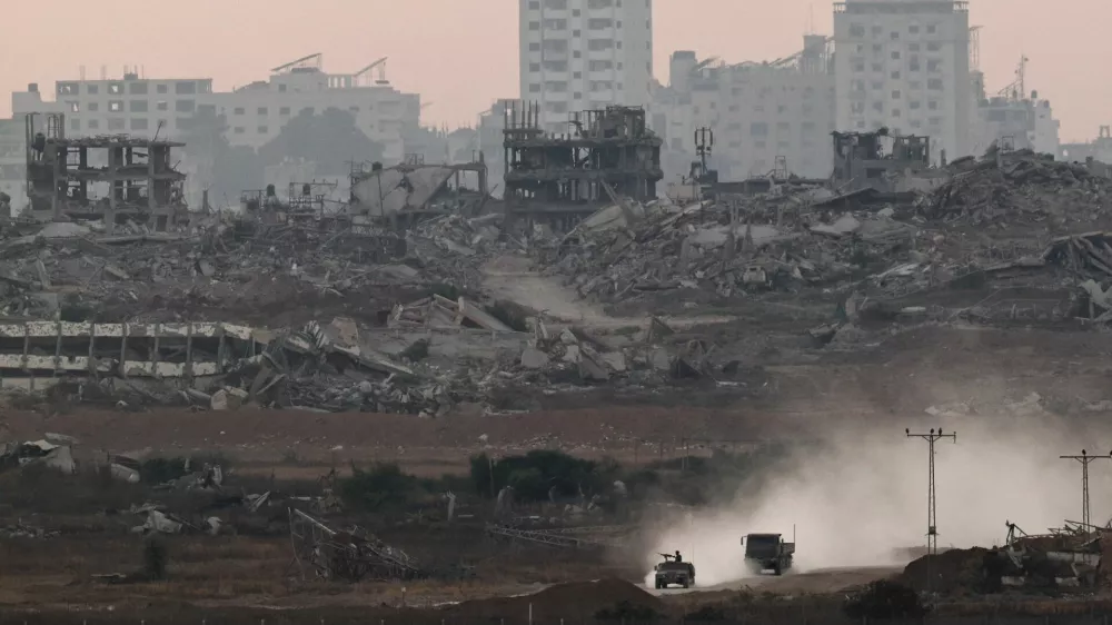 Israeli military vehicles manoeuvre inside the Gaza strip, as seen from Israel, June 25, 2025. REUTERS/Amir Cohen
