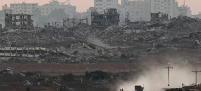 Israeli military vehicles manoeuvre inside the Gaza strip, as seen from Israel, June 25, 2025. REUTERS/Amir Cohen
