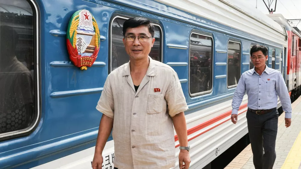 RUSSIA, MOSCOW - JUNE 25, 2025: Employees of the Korean State Railway are seen as the Pyongyang - Moscow passenger train arrives at the Yaroslavsky railway station. The train service between Pyongyang and Moscow has resumed after a five-year suspension due to the COVID-19 pandemic,Image: 1014894016, License: Rights-managed, Restrictions: * Switzerland And Russia Rights Out *, Model Release: no