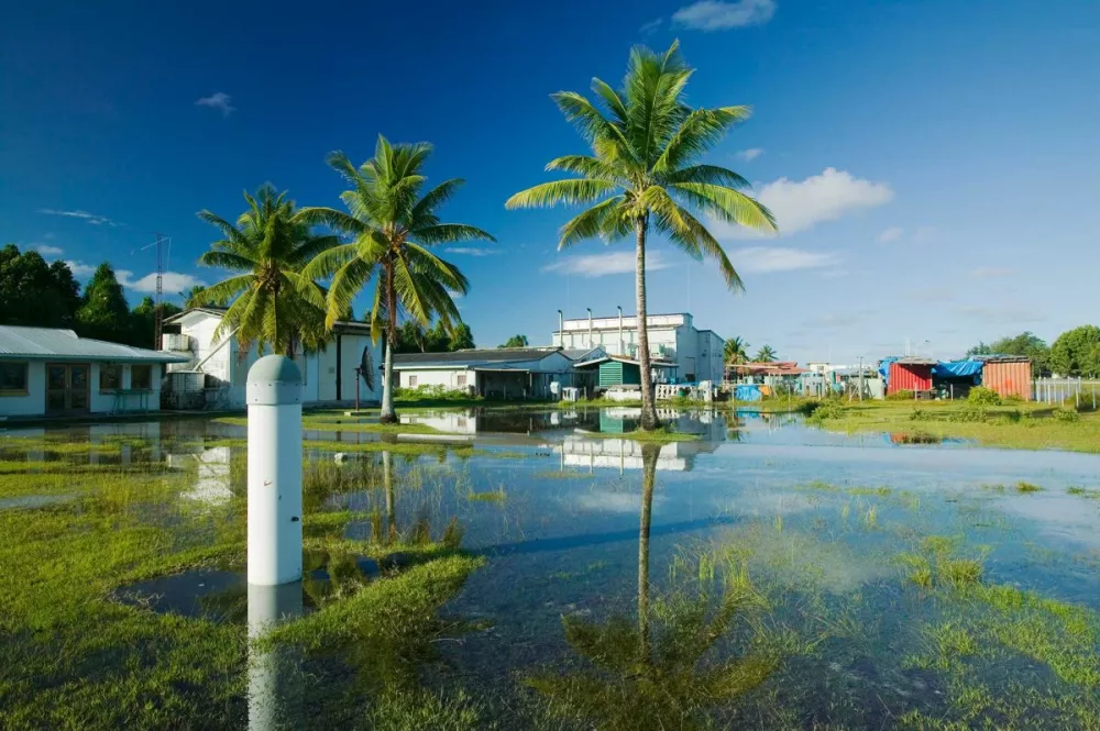 ﻿This image was taken in 2007, showing a town submerged in water on the Funafuti Atoll. Its population of more than 6,000 people has been battling with the direct consequences of rising sea levels. Residents of the capital Tuvalu have seen very frequent flooding in populated areas due to the fact that it is at most 4.57 meters (15 feet) above sea level. Dubbed one of "the most vulnerable Pacific Ocean islands," its residents have to make the ultimate choice: leave the islands or deal with the consequences.