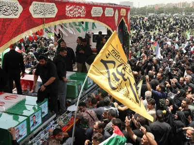 People attend the funeral procession of Iranian military commanders, nuclear scientists and others killed in Israeli strikes, in Tehran, Iran, June 28, 2025. Majid Asgaripour/WANA (West Asia News Agency) via REUTERS  ATTENTION EDITORS - THIS PICTURE WAS PROVIDED BY A THIRD PARTY