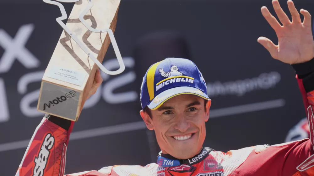 Race winner Spain's rider Marc Marquez of the Ducati Lenovo Team celebrates on the podium after the MotoGP race of the Grand Prix of Aragon at the MotorLand Aragon circuit, in Alcaniz, Spain, Sunday, June 8, 2025. (AP Photo/Jose Breton)