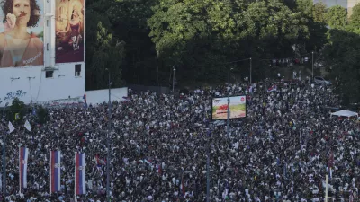 People attend a major anti-government rally to press their demand for an early election after nearly eight months of almost daily anti-corruption demonstrations that have shaken the populist government of President Aleksandar Vucic, in Belgrade, Serbia, Saturday, June 28, 2025. (AP Photo/Marko Drobnjakovic)
