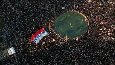 A drone view shows Serbian students and other demonstrators participating in an anti-government protest demanding snap elections at the Slavija square, in Belgrade, Serbia, June 28, 2025. REUTERS/Djordje Kojadinovic 