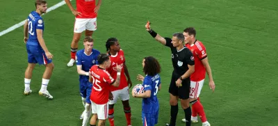 Soccer Football - FIFA Club World Cup - Round of 16 - Benfica v Chelsea - Bank of America Stadium, Charlotte, North Carolina, U.S. - June 28, 2025 Benfica's Gianluca Prestianni is shown a red card by referee Slavko Vincic REUTERS/Mike Segar