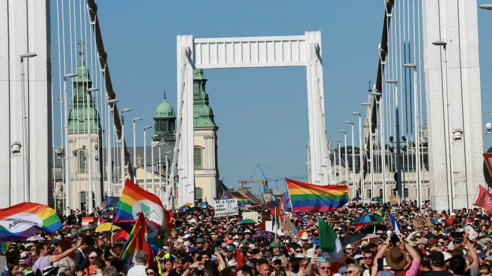 FILE PHOTO: People cross the Elisabeth Bridge during the Budapest Pride March in Budapest, Hungary, June 28, 2025. REUTERS/Bernadett Szabo/File Photo