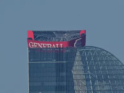 A partially collapsed sign of the Generali insurance headquarters is seen at the top of the Hadid tower in Milan, Italy, June 30, 2025. REUTERS/Daniele Mascolo