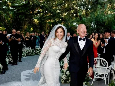 Amazon Founder Jeff Bezos and Media Personality Lauren Sanchez Bezos react on the day of their wedding in Venice, Italy, June 27, 2025 in this picture obtained from social media. @laurensanchezbezos via Instagram/via REUTERS THIS IMAGE HAS BEEN SUPPLIED BY A THIRD PARTY. MANDATORY CREDIT. NO RESALES. NO ARCHIVES.   TPX IMAGES OF THE DAY