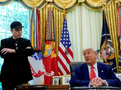 FILE PHOTO: U.S. President Donald Trump and Elon Musk attend a press conference in the Oval Office of the White House in Washington, D.C., U.S., May 30, 2025. REUTERS/Nathan Howard/File Photo