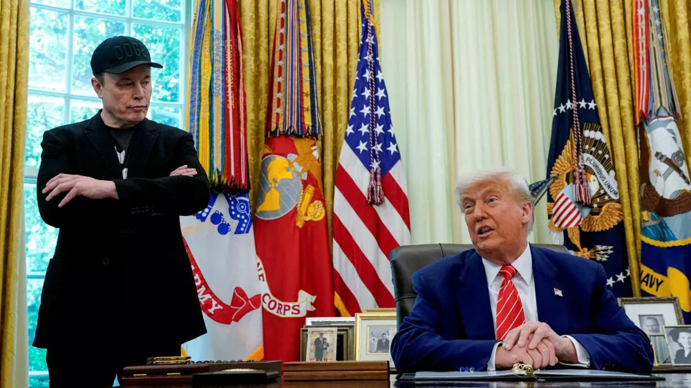 FILE PHOTO: U.S. President Donald Trump and Elon Musk attend a press conference in the Oval Office of the White House in Washington, D.C., U.S., May 30, 2025. REUTERS/Nathan Howard/File Photo