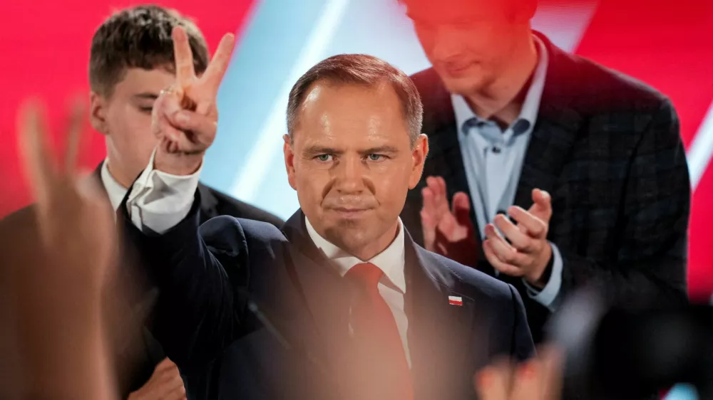 Polish presidential candidate Karol Nawrocki, backed by the main opposition Law and Justice (PiS) party, reacts to the exit polls of the second round of the presidential election, in Warsaw, Poland, June 1, 2025. REUTERS/Aleksandra Szmigiel   TPX IMAGES OF THE DAY