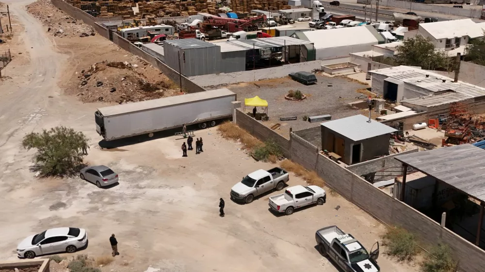 A drone view shows authorities working at a crematorium where they found bodies piled up in unsanitary conditions, after local funeral homes hired its services for cremation, according to the Chihuahua State Prosecutor's Office, in Ciudad Juarez, Mexico June 30, 2025. REUTERS/Jose Luis Gonzalez