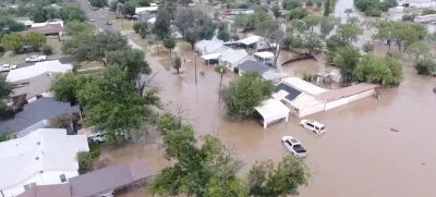 A drone view shows flooded houses, following torrential rains that unleashed flash floods along the Concho River in San Angelo, Texas, U.S., July 4, 2025, in this screen grab obtained from a social media video. Patrick Keely via REUTERS  THIS IMAGE HAS BEEN SUPPLIED BY A THIRD PARTY. MANDATORY CREDIT. NO RESALES. NO ARCHIVES.   TPX IMAGES OF THE DAY   REFILE - CORRECTING NAME OF RIVER FROM "GUADALUPE" TO "CONCHO" AND MONTH FROM "JUNE" TO "JULY