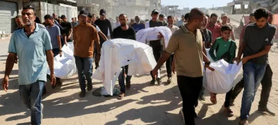 Mourners carry the bodies of Palestinians, who, according to Gaza's health ministry, were killed in an overnight Israeli strike on a tent, outside Nasser Hospital in Khan Younis, southern Gaza Strip, July 3, 2025. REUTERS/Hatem Khaled   TPX IMAGES OF THE DAY