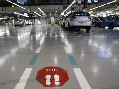 ﻿FILE - This Jan.28 2013 file photo, shoiws the French car manufacturer PSA Peugeot Citroen assembly line in Aulnay-sous-Bois, north of Paris. The maker of Peugeot and Citroen cars hopes to lay off 1,300 people this year and hire another 1,300 under new labor rules championed by President Emmanuel Macron to give companies more flexibility to hire and fire. PSA is among the first big companies to apply the new rules, which came into effect this month(AP Photo/Christophe Ena, File)