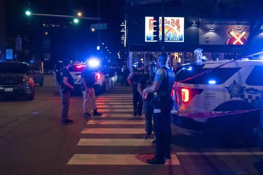 Chicago police investigate the scene of a shooting that took place at Artis Restaurant and Lounge located on Chicago Avenue in the River North neighborhood, Thursday, July 3, 2025. (Tyler Pasciak LaRiviere/Chicago Sun-Times via AP)
