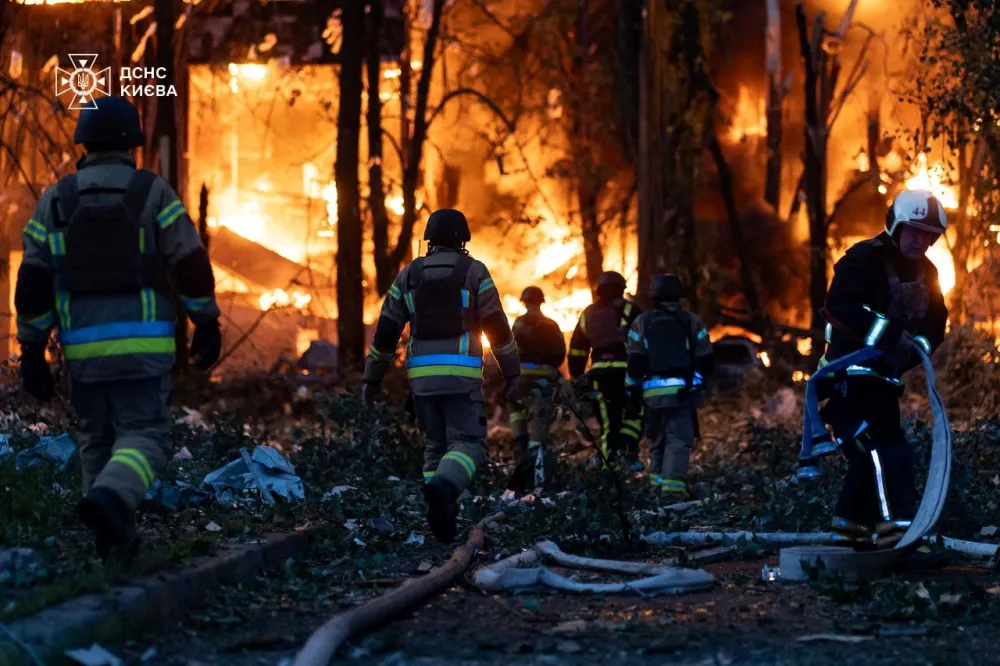 Firefighters work at the site of the Russian drone and missile strike, amid Russia's attack on Ukraine, in Kyiv, Ukraine July 4, 2025. Press service of the State Emergency Service of Ukraine in Kyiv/Handout via REUTERS ATTENTION EDITORS - THIS IMAGE HAS BEEN SUPPLIED BY A THIRD PARTY. MUST NOT OBSCURE LOGO.
