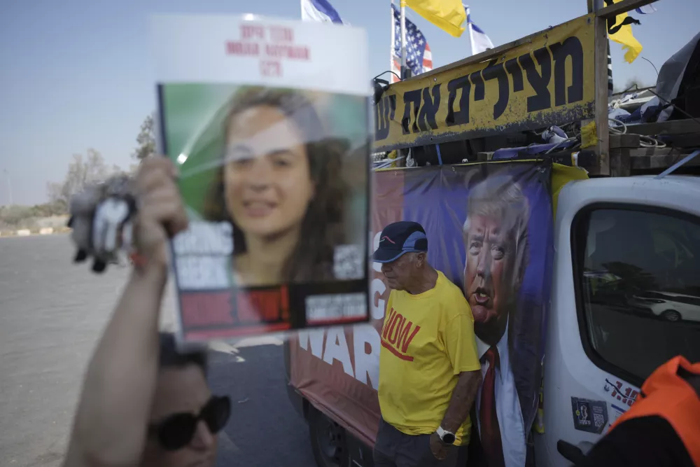People take part in a protest demanding an end to the war and the immediate release of hostages held by Hamas in the Gaza Strip, at the site of the October 7, 2023 Hamas attack on the Nova music festival near Kibbutz Reim, southern Israel, Wednesday, July 2, 2025. (AP Photo/Ohad Zwigenberg)