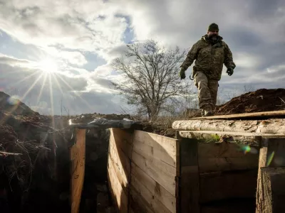 FILE PHOTO: Ukrainian military engineer with the callsign Lynx inspects a freshly dug trench that his unit built as part of a system of new fortifications near the front lines outside Kupiansk, amid Russia's attack on Ukraine, December 28, 2023. REUTERS/Thomas Peter/File Photo