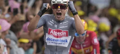 Belgium's Jasper Philipsen celebrates as he crosses the finish line to win the first stage of the Tour de France cycling race over 184.9 kilometers (114.9 miles) with start and finish in Lille, France, Saturday, July 5, 2025. (AP Photo/Thibault Camus)