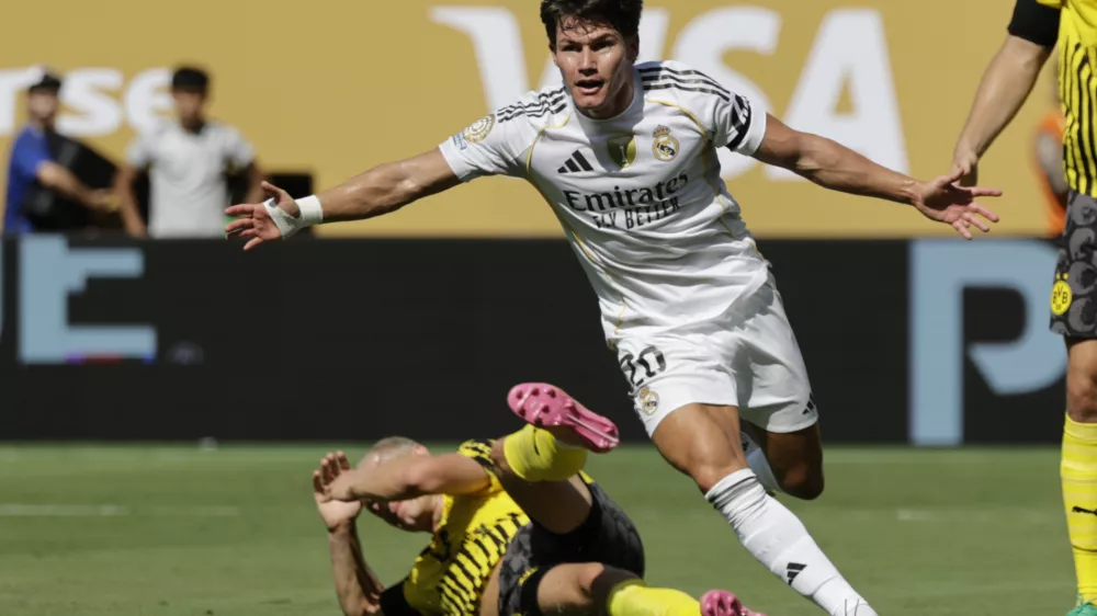 Real Madrid's Fran Garcia celebrates after scoring his side's second goal against Borussia Dortmund during the Club World Cup quarterfinal soccer match between Real Madrid and Borussia Dortmund in East Rutherford, N.J., Saturday, July 5, 2025. (AP Photo/Adam Hunger)