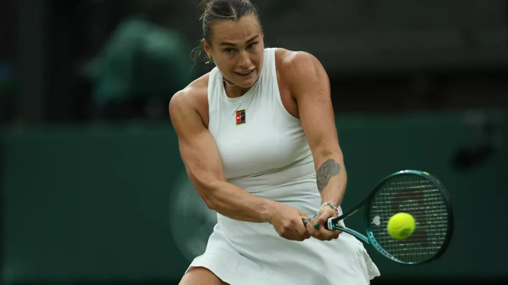 Tennis - Wimbledon - All England Lawn Tennis and Croquet Club, London, Britain - July 6, 2025 Belarus' Aryna Sabalenka in action during her round of 16 match against Belgium's Elise Mertens REUTERS/Isabel Infantes