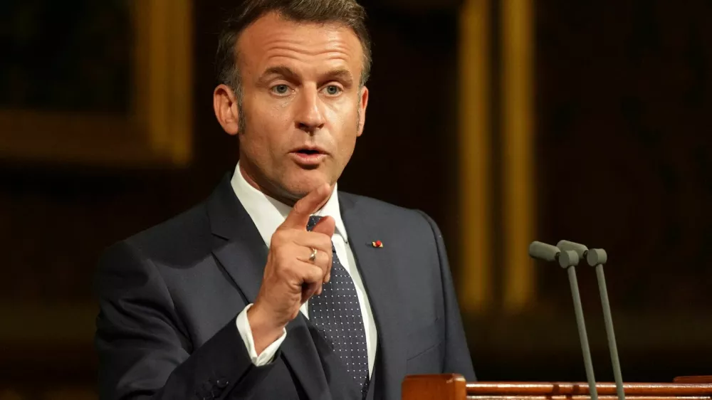 French President Emmanuel Macron addresses parliament in the Palace of Westminster, London, Tuesday, July 8, 2025.  Alastair Grant/Pool via REUTERS
