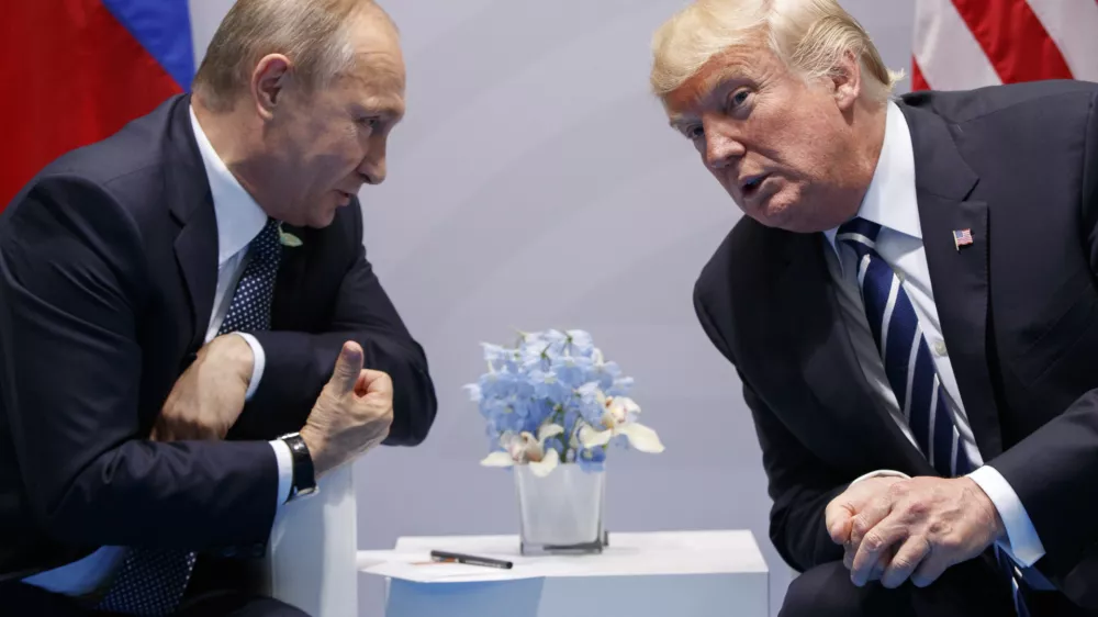 FILE - President Donald Trump, right, meets with Russian President Vladimir Putin at the G-20 Summit in Hamburg, July 7, 2017. (AP Photo/Evan Vucci, File)