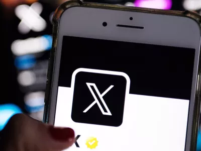 FILED - 24 July 2023, Berlin: The official profile of Platform X on the screen of a smartphone shows the white letter X on a black background. The European Commission is taking legal steps against Elon Musk's social media platform X, formerly Twitter, over the spread of disinformation and transparency breaches. Photo: Monika Skolimowska/dpa