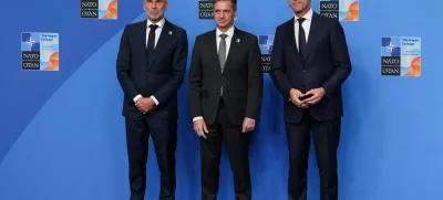 NATO Secretary General Mark Rutte and Dutch Prime Minister Dick Schoof welcome Slovenian Prime Minister Robert Golob at a NATO summit in The Hague, Netherlands June 25, 2025. REUTERS/Claudia Greco