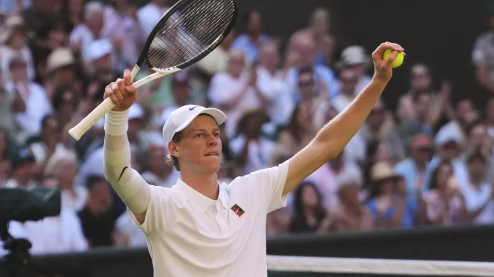 Jannik Sinner of Italy celebrates winning the men's semifinal singles match against Novak Djorkovic of Serbia at the Wimbledon Tennis Championships in London, Friday, July 11, 2025.(AP Photo/Kirsty Wigglesworth)