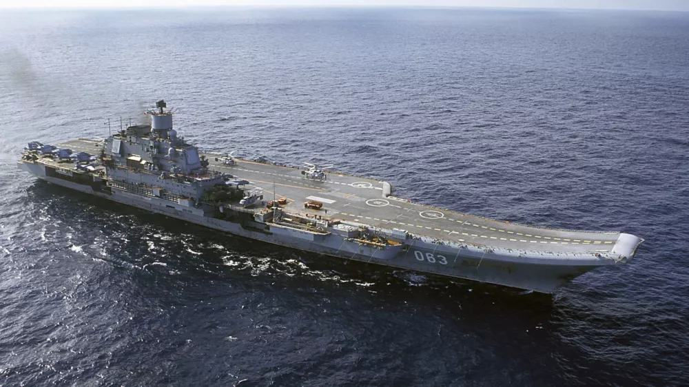﻿FILE - In this 2004 file photo the Admiral Kuznetsov carrier seen in the Barents Sea, Russia. The Russian military says one of its the MiG-29 fighter jets based at a Russian aircraft carrier currently near Syria's shores has crashed on a training mission, but its pilot has survived. (AP Photo, File)