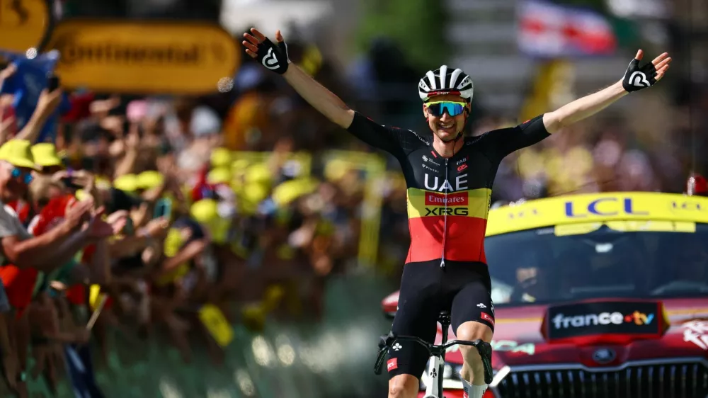 Cycling - Tour de France - Stage 15 - Muret to Carcassonne - Muret, France - July 20, 2025 UAE Team Emirates XRG's Tim Wellens celebrates as he crosses the finish line to win stage 15 REUTERS/Sarah Meyssonnier