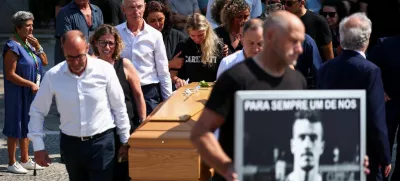 Maria Rodrigues reacts as pallbearers carry a coffin, at the funeral ceremony of her late husband Andre Silva, brother of Liverpool's Portuguese soccer player Diogo Jota, who both died in a car crash near Zamora, Spain, at the Chapel of the Resurrection, in Gondomar, Portugal, July 5, 2025. REUTERS/Pedro Nunes