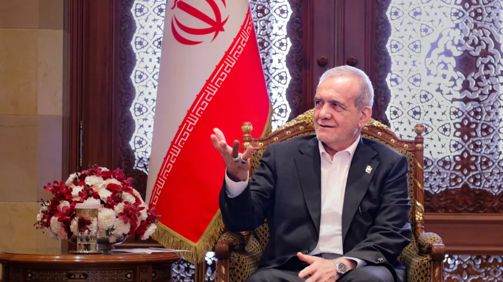 FILED - 28 May 2025, Oman, Muscat: Iran's President Masoud Pezeshkian speaks with Sayyid Fahd Bin Mahmoud Al-Said (not pictured), the Deputy Prime Minister for the Council of Ministers in the Sultanate of Oman as they meet in Muscat. Photo: --/Iranian Presidency/dpa - ATTENTION: editorial use only and only if the credit mentioned above is referenced in full