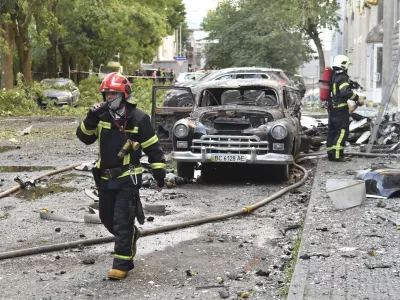 Firefighters work at the site of Russian air attack in Lviv, Ukraine, Saturday, July 12, 2025. (AP Photo/Mykola Tys)