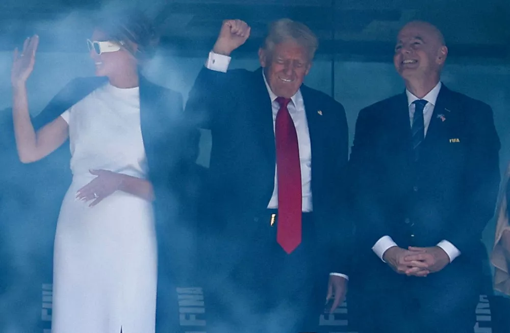Soccer Football - FIFA Club World Cup - Final - Chelsea v Paris St Germain - MetLife Stadium, East Rutherford, New Jersey, U.S. - July 13, 2025 U.S. President Donald Trump and first lady Melania Trump in the stands with FIFA president Gianni Infantino and his wife Leena Al Ashqar before the match, the FIFA Club World Cup trophy can be seen in front of them REUTERS/Kai Pfaffenbach