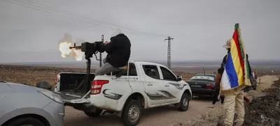 A Druze militiaman fires from a machine-gun attached on the back of a truck during a shooting practice in the southern province of Sweida, Syria, March 4, 2025. (AP Photo/Omar Sanadiki)