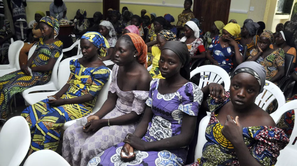 ﻿Chibok school girls recently freed from Boko Haram captivity are seen in Abuja, Nigeria, Sunday, May 7, 2017. The 82 freed Chibok schoolgirls arrived in Nigeria's capital on Sunday to meet President Muhammadu Buhari as anxious families awaited an official list of names and looked forward to reuniting three years after the mass abduction. (AP Photo/ Olamikan Gbemiga)