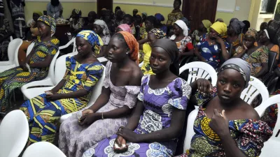 ﻿Chibok school girls recently freed from Boko Haram captivity are seen in Abuja, Nigeria, Sunday, May 7, 2017. The 82 freed Chibok schoolgirls arrived in Nigeria's capital on Sunday to meet President Muhammadu Buhari as anxious families awaited an official list of names and looked forward to reuniting three years after the mass abduction. (AP Photo/ Olamikan Gbemiga)