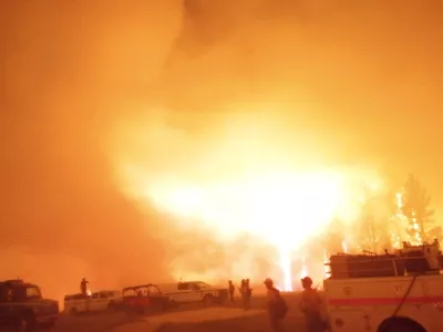 Firefighters and emergency vehicles are positioned in front of the Dragon Bravo Fire in Grand Canyon, Arizona, U.S. in this image released July 13, 2025.  National Park Service/Handout via REUTERS  THIS IMAGE HAS BEEN SUPPLIED BY A THIRD PARTY. MANDATORY CREDIT.