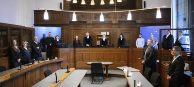 From left, defendant lawyers Klaudia Dawidowic, Ria Halbritter and Christoph Stoll, presiding judge Sylvia Busch, center, and public prosecutor Philipp Meyhöfer, second right, as a doctor has gone on trial over the alleged murder of 15 patients under palliative care, at Berlin Regional Court, Germany, Monday July 14, 2025. (Bernd von Jutrczenka/dpa via AP)