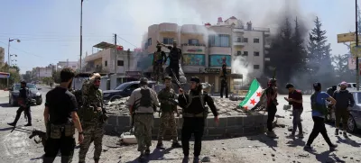 Members of Syrian security forces stand together after Syrian troops entered the predominantly Druze city of Sweida on Tuesday following two days of clashes, in Sweida, Syria July 15, 2025. REUTERS/Karam al-Masri   TPX IMAGES OF THE DAY