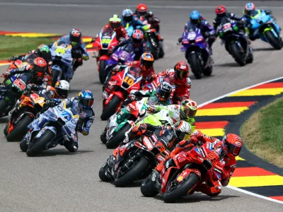 MotoGP - German Grand Prix - Sachsenring, Hohenstein-Ernstthal, Germany - July 13, 2025 Ducati Lenovo Team's Marc Marquez, BK8 Gresini Racing MotoGP's Alex Marquez and Aprilia Racing's Marco Bezzecchi in action with riders during the race REUTERS/Lisi Niesner   TPX IMAGES OF THE DAY