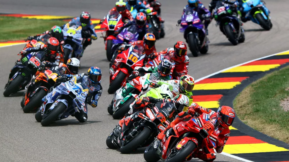MotoGP - German Grand Prix - Sachsenring, Hohenstein-Ernstthal, Germany - July 13, 2025 Ducati Lenovo Team's Marc Marquez, BK8 Gresini Racing MotoGP's Alex Marquez and Aprilia Racing's Marco Bezzecchi in action with riders during the race REUTERS/Lisi Niesner   TPX IMAGES OF THE DAY