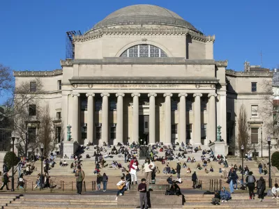 FILE - Students sit on the front steps of Low Memorial Library on the Columbia University campus in New York City, Feb. 10, 2023. (AP Photo/Ted Shaffrey, File)