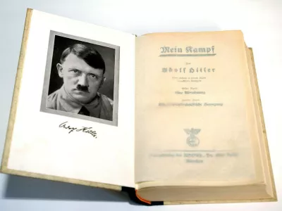 (dpa) - A copy of the first edition of Adolf Hitler's 'Mein Kampf' (My Struggle) features a frontispiece of the Fuehrer, pictured in Germany, 2003. In 1923 Adolf Hitler was arrested for attempting to overthrow the government in Munich and his National Socialist German Workers' Party (the Nazi party NSDAP) was disbanded. While in prison he wrote the first volume of 'Mein Kampf', outlining his political ideas. 'Mein Kampf' was not taken seriously at first, but it includes many of the ideas the Nazis put in practice in the 1930s and 1940s.,Image: 676250941, License: Rights-managed, Restrictions:, Model Release: no