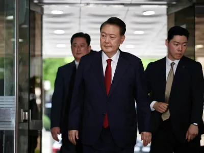 FILE PHOTO: Former South Korean President Yoon Suk Yeol arrives at a court to attend a hearing to review his arrest warrant requested by special prosecutors in Seoul, South Korea, July 9, 2025.  REUTERS/Kim Hong-Ji/Pool/File Photo
