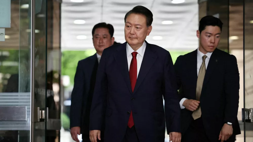 FILE PHOTO: Former South Korean President Yoon Suk Yeol arrives at a court to attend a hearing to review his arrest warrant requested by special prosecutors in Seoul, South Korea, July 9, 2025.  REUTERS/Kim Hong-Ji/Pool/File Photo